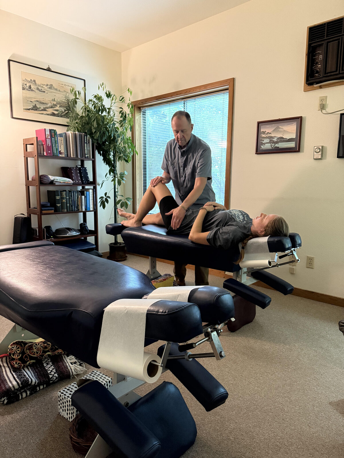 Dr. Mark performing a gentle, low-force adjustment on a relaxed patient